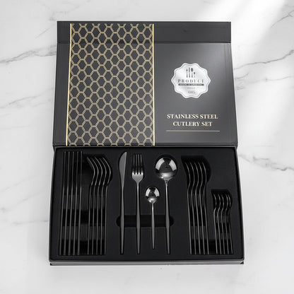 24-piece black stainless steel flatware set displayed in a gift box on countertop