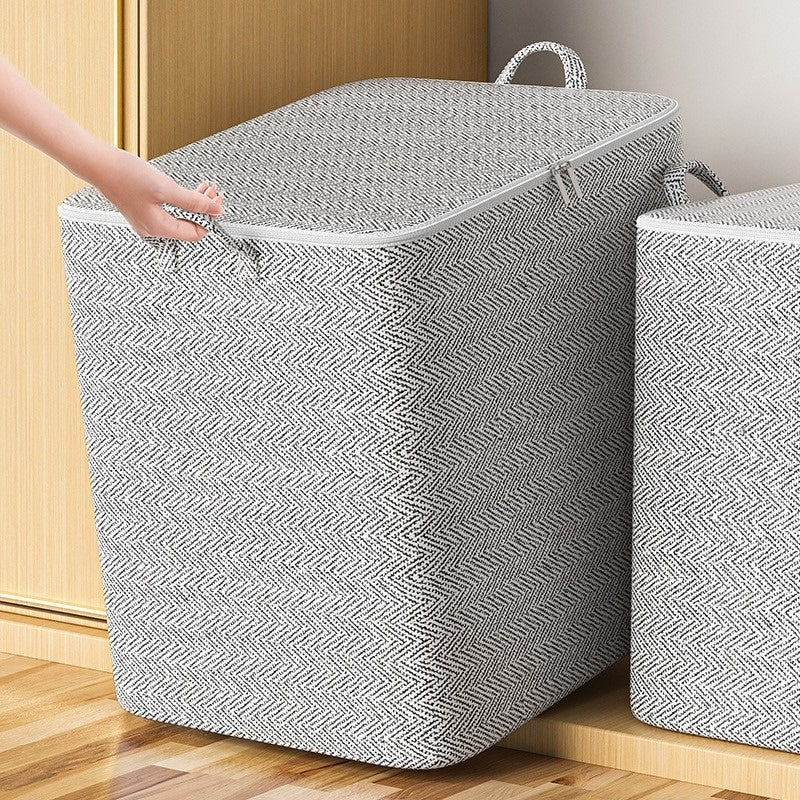 Large gray herringbone fabric storage bin with a zippered lid and built-in carrying handles.