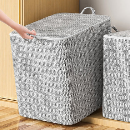 Large gray herringbone fabric storage bin with a zippered lid and built-in carrying handles.