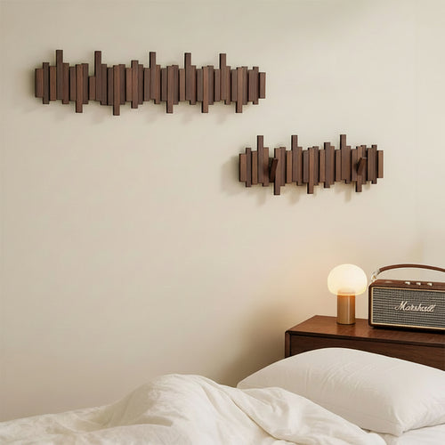 Two no-drill solid wood piano-key wall hooks with nightstand and bed 