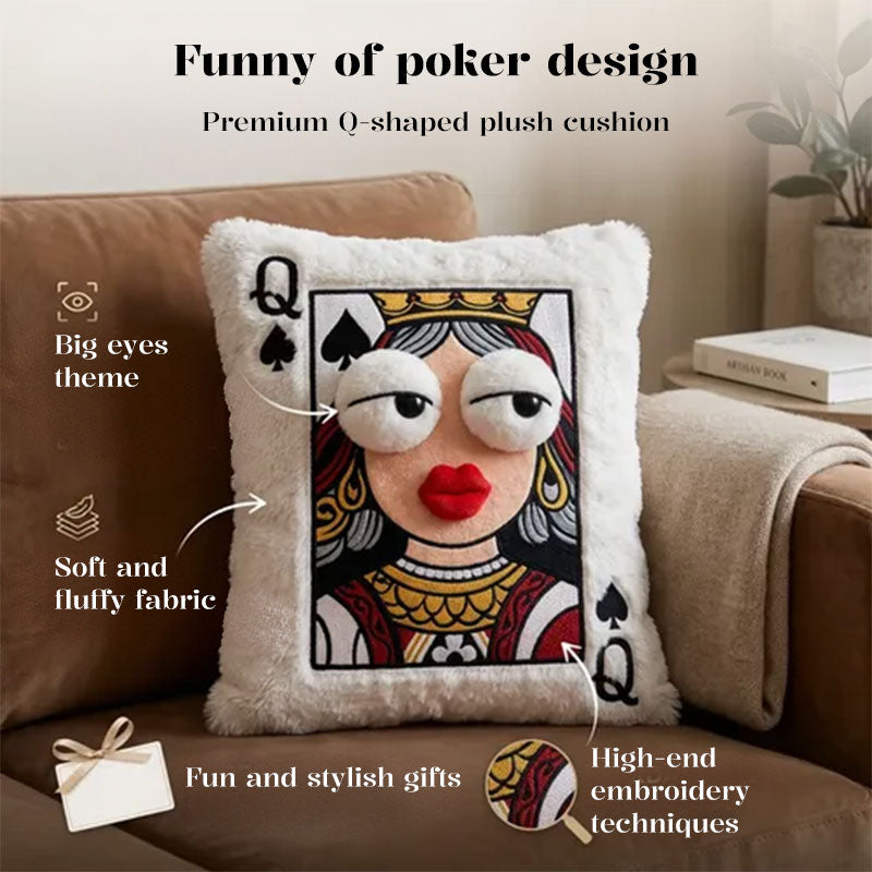 Embroidered Queen playing card throw pillow with big-eye design and soft fluffy fabric displayed on a beige sofa.
