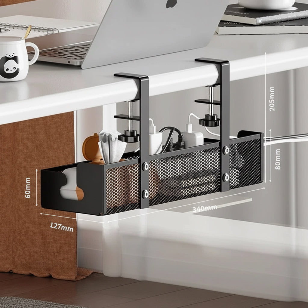Black clamp-on under-desk storage organizer with mesh sides holding cables, chargers, and small accessories