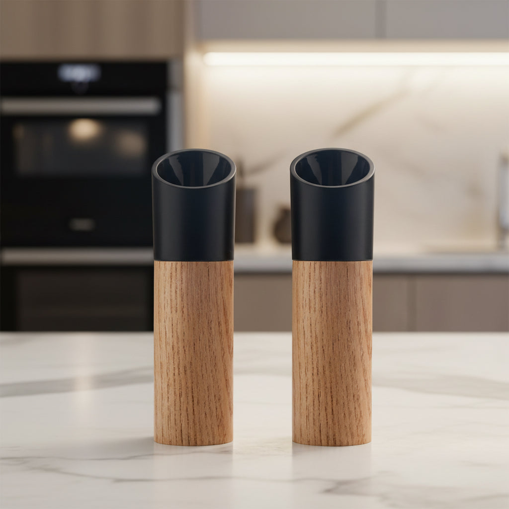 Two black adjustable wooden salt and pepper grinders displayed together