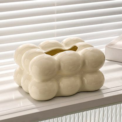 Cream white bubble ceramic tissue box cover displayed on a white table