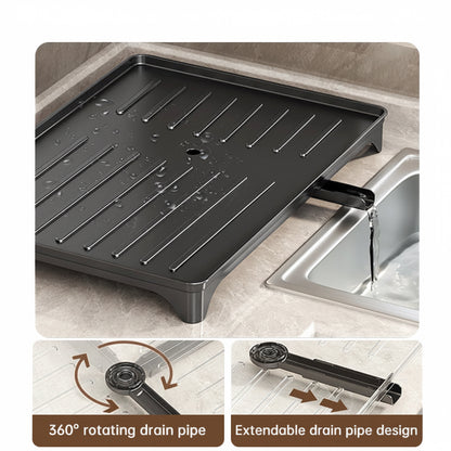 Black dish rack drainboard with an extendable 360-degree rotating drain spout directing water into a sink