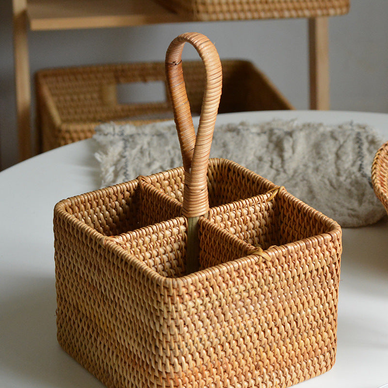 Handwoven rattan storage basket with divided compartments and carrying handle