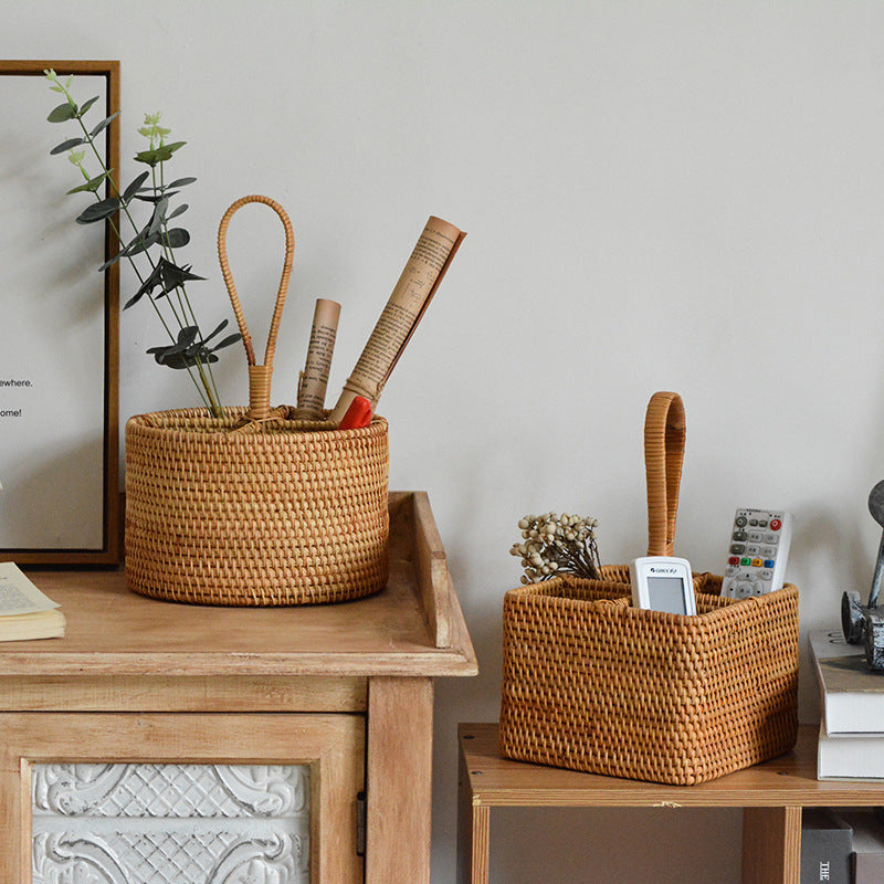 Handwoven rattan storage baskets used for home organization and remote control storage