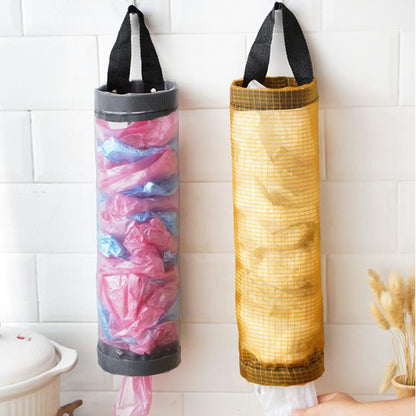 Gray and yellow hanging mesh bag holders dispensing reusable plastic bags from the bottom.