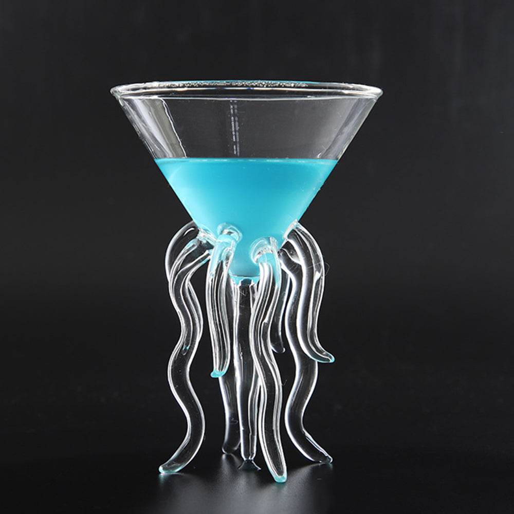 Jellyfish cocktail glass with sculpted tentacle stem holding a blue drink