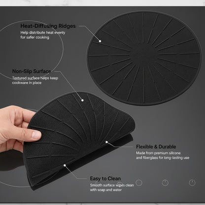 Black silicone induction cooktop mat under a cooking pan while protecting the glass cooktop surface