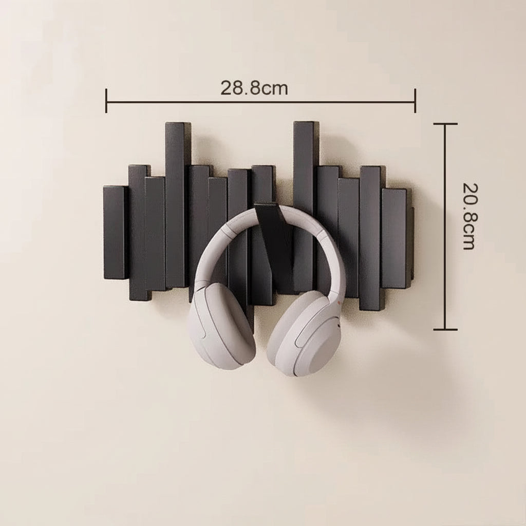 Decorative black wooden wall mounted coat rack shown in on wall will white headphones hanging on it and the dimensions on top and side