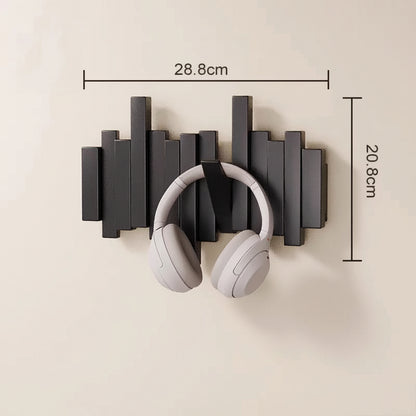 Decorative black wooden wall mounted coat rack shown in on wall will white headphones hanging on it and the dimensions on top and side