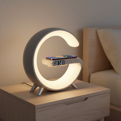 White circular LED bedside lamp with warm ambient light, digital clock, and smartphone on wireless charging platform