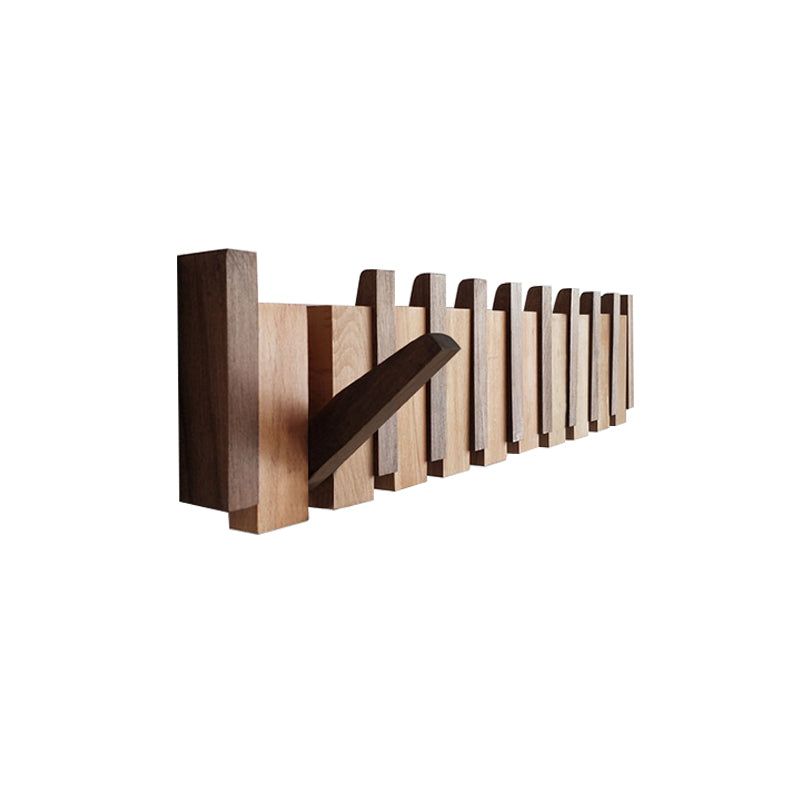 Side view of wooden wall mounted coat rack showing individual folding storage hooks