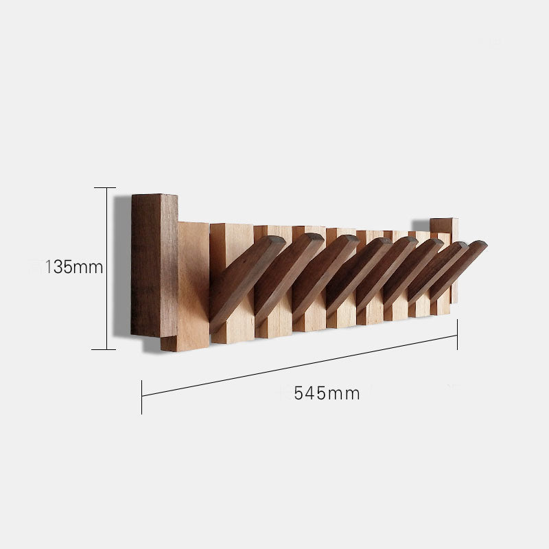 Wooden wall mounted coat rack with folding hooks shown in 545 millimeter size